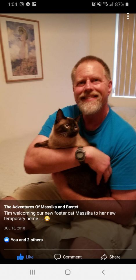 Tim holds a cat